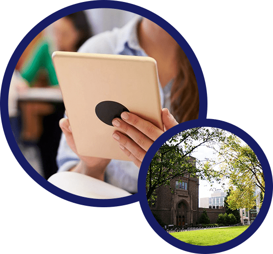 A person holding an ipad in front of a building.