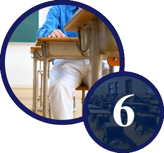 A person sitting at a desk in front of an open window.